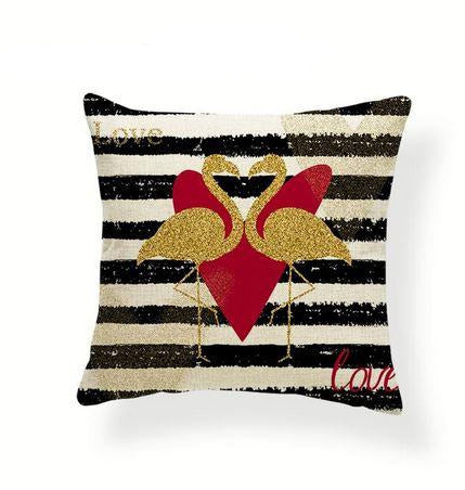 coussin rayé noir et or avec flamant rose or