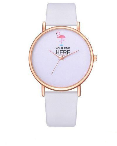 montre blanche avec flamant rose